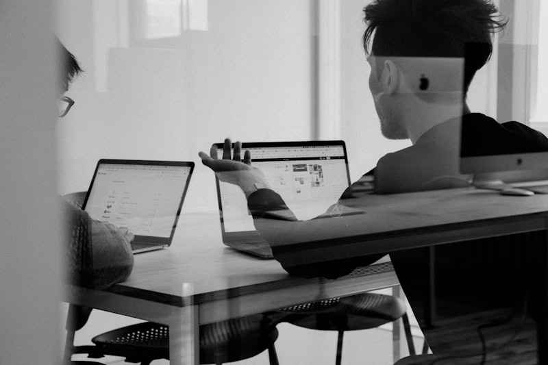 Engineers pair programming at a standing desk